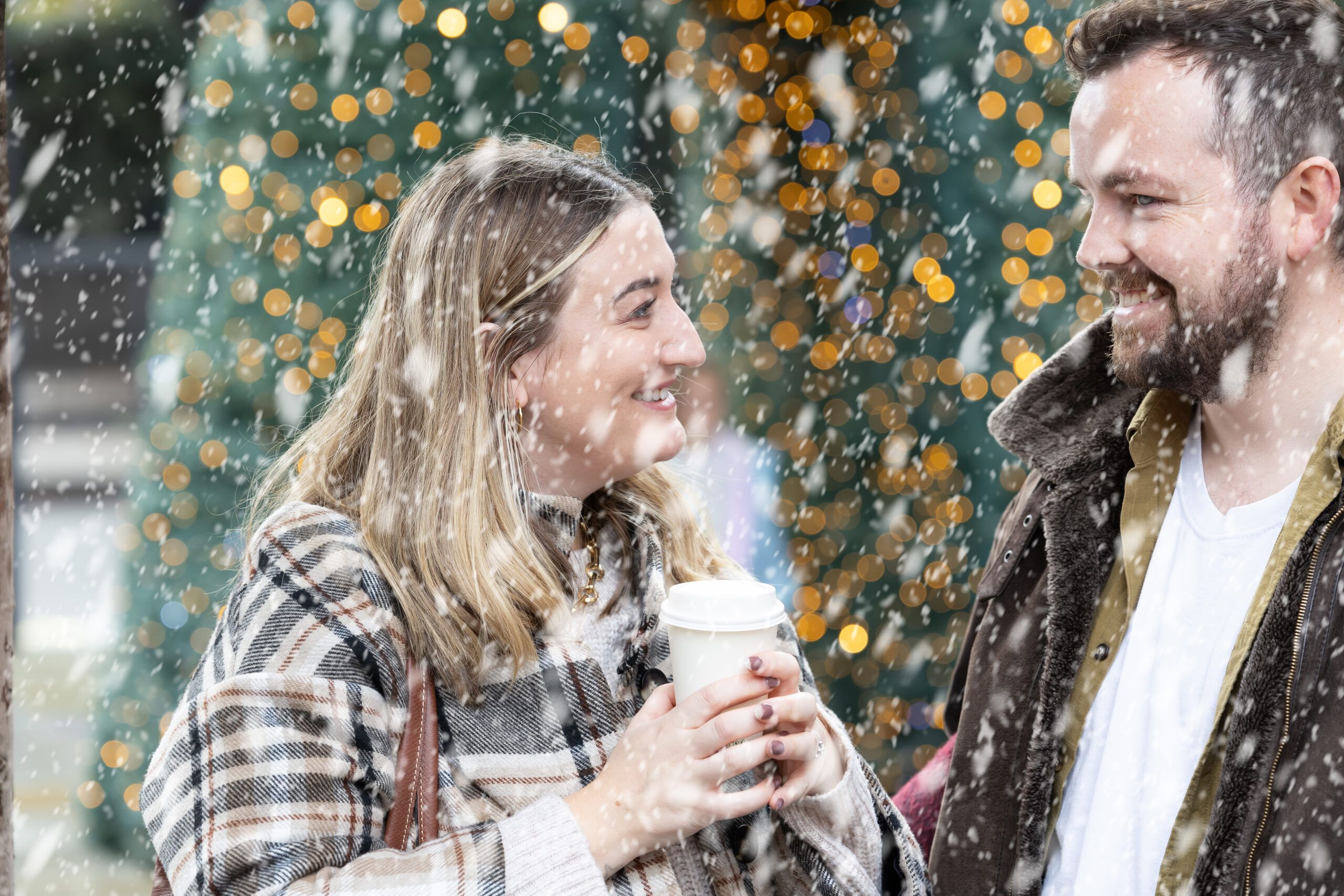 couple having coffee in snow